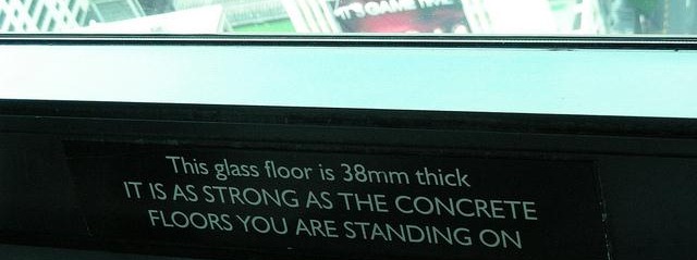 Sign: this glass floor is 38mm thick - it is as strong as the concrete floors you are standing on
